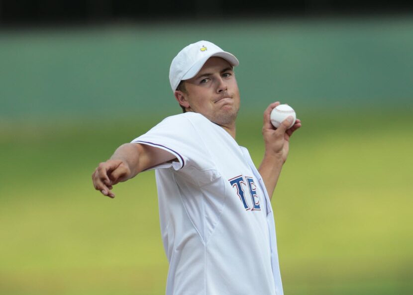 ARLINGTON, TX - AUGUST 18: PGA golfer Jordan Spieth throws the first pitch of the game...