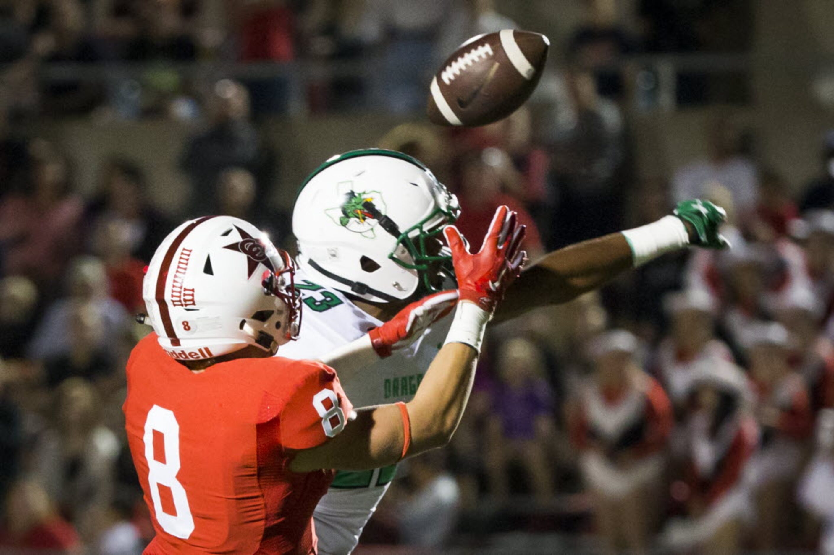 Southlake Carroll defensive back Obi Eboh (23) breaks up a pass intended for Coppell wide...