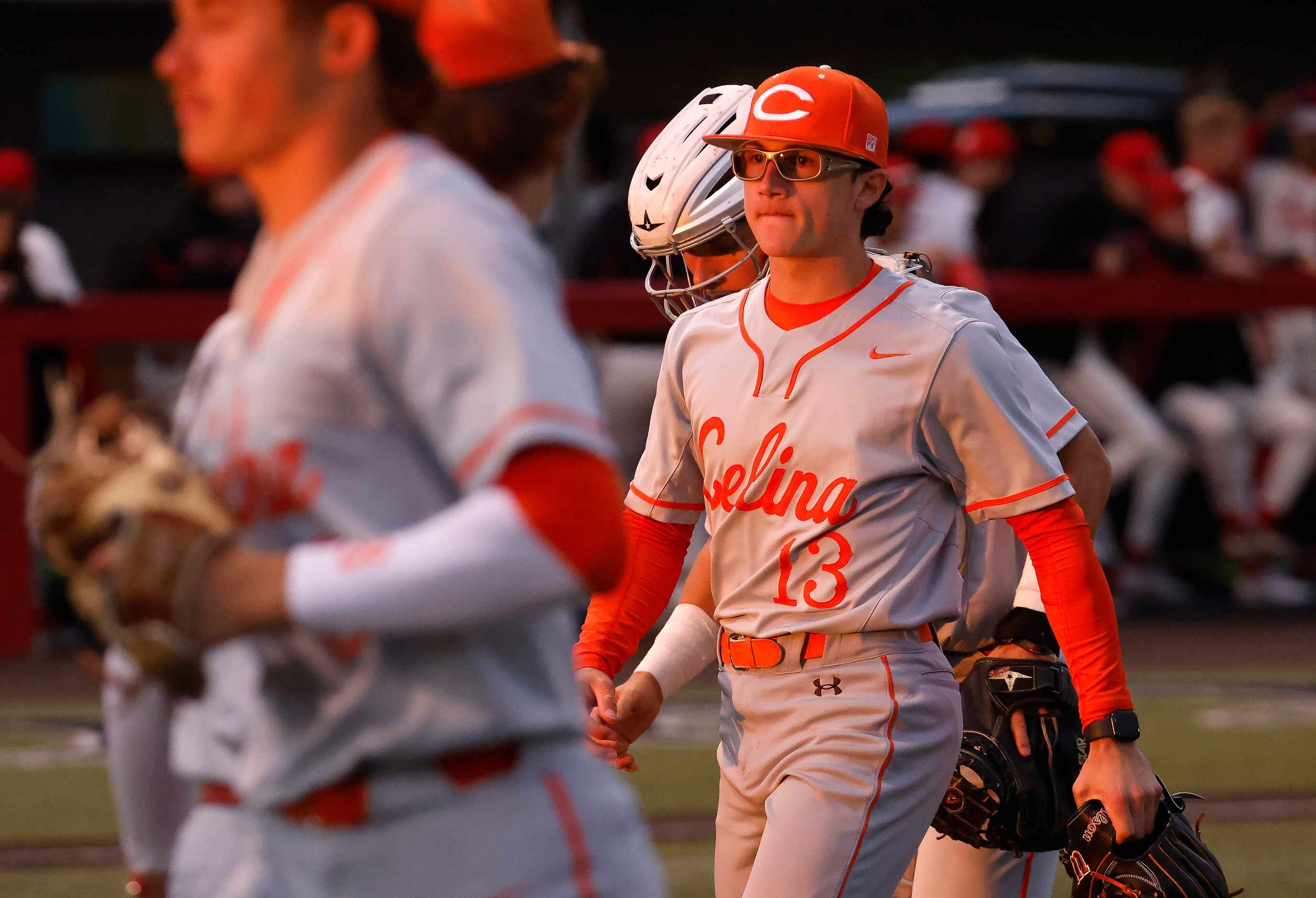 Celina High starting pitcher Brady Broeckel (13) walks off the mound after throwing in the...