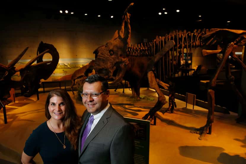 Abraham-Silver and Saenz, in front of the Pachyrhinosaurus skeleton display at the Perot,...
