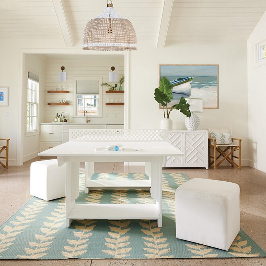 Sitting area in a home with table and cube-shaped ottoman chairs