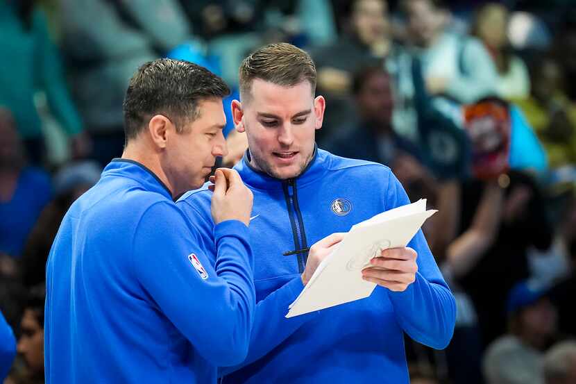Dallas Mavericks shooting coach Peter Patton (left) works with assistant coach Greg St. Jean...