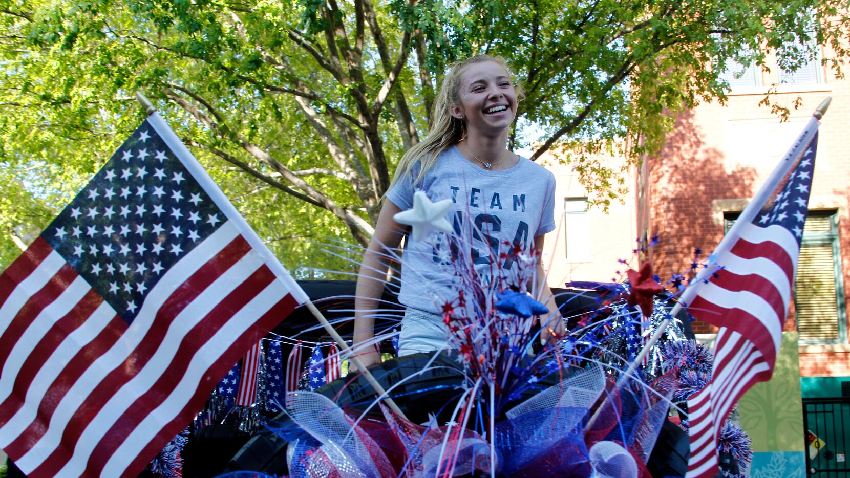 Hailey Hernandez revels in the moment as a parade planned in her honor began around the...