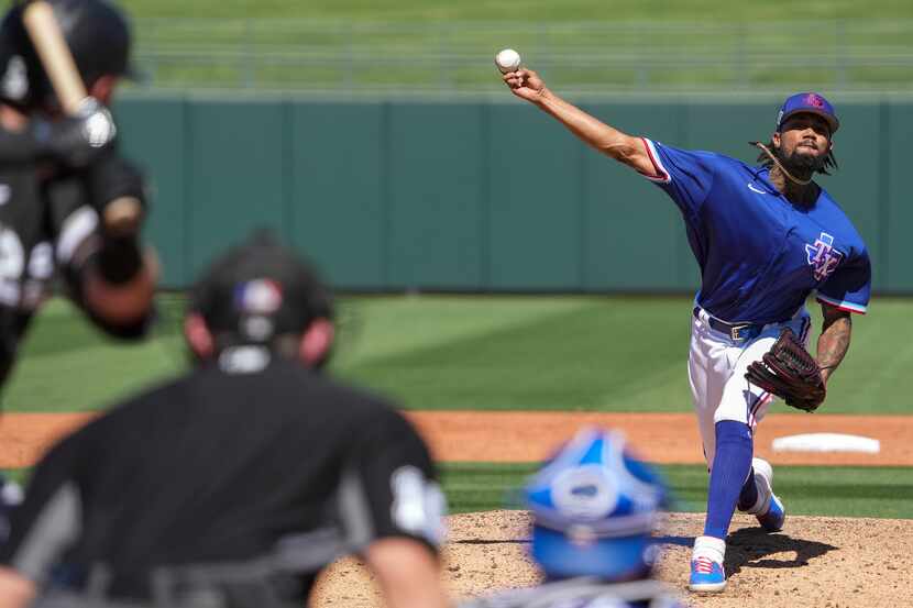 Texas Rangers pitcher Dennis Santana delivers during the third inning of a spring training...