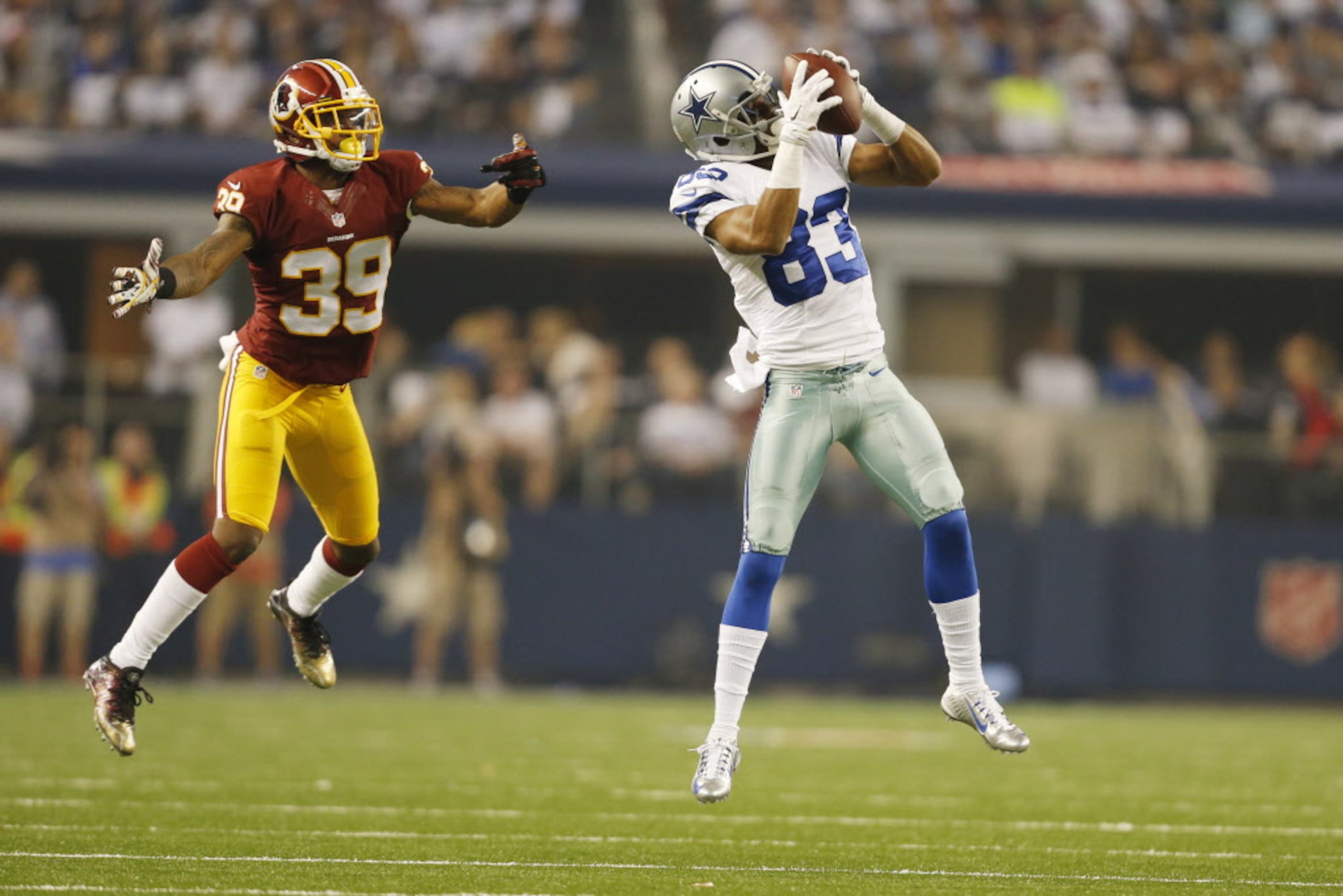 Dallas Cowboys wide receiver Terrance Williams (83) catches a pass in front of Washington...