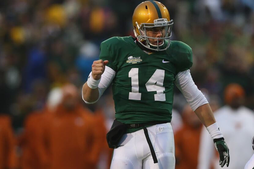 Bryce Petty #14 of the Baylor Bears celebrates a touchdown against the Texas Longhorns at...