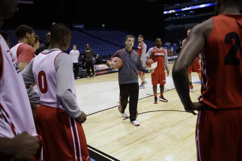 Louisville head coach Rick Pitino talks to his players during practice for the NCAA Midwest...