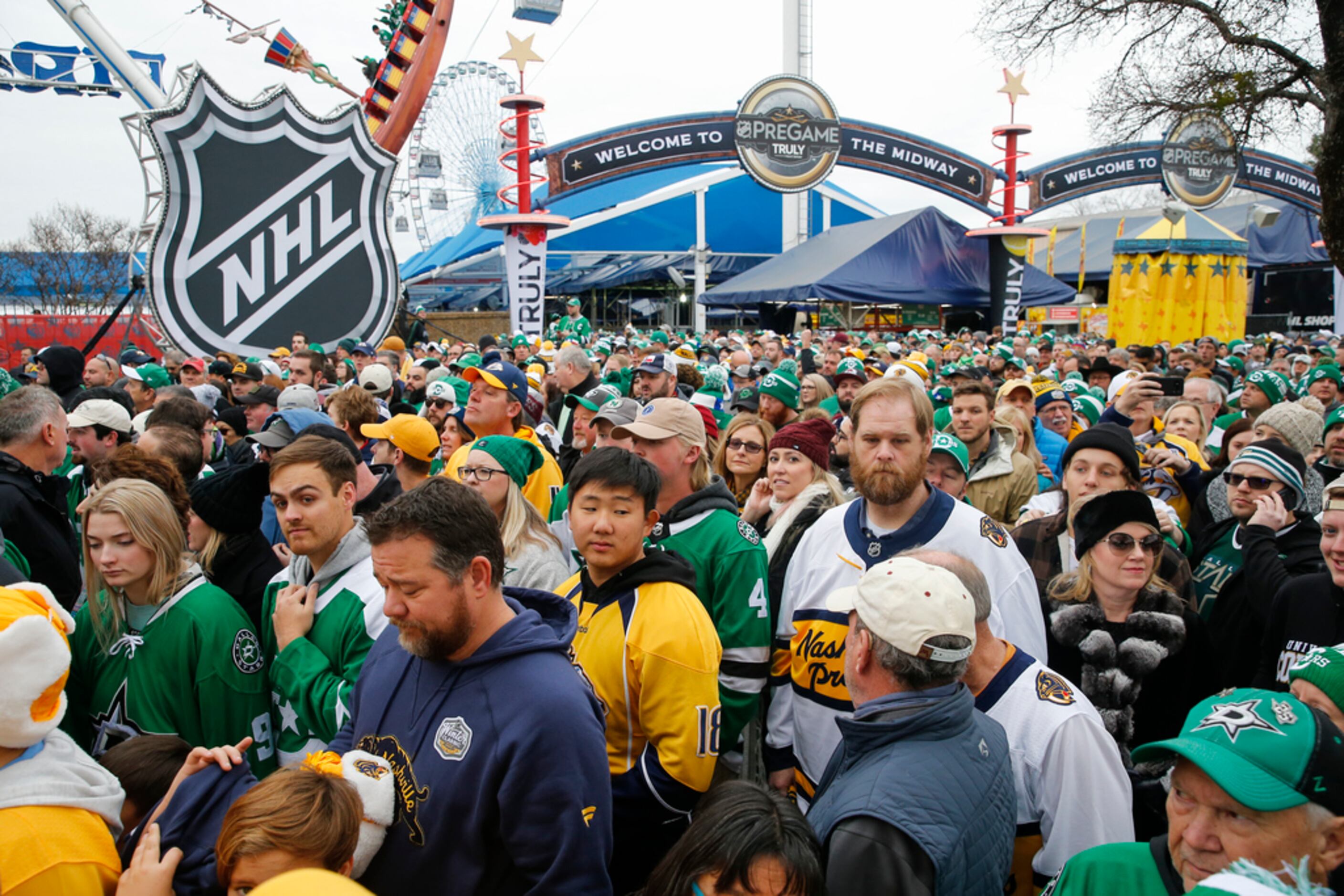 Fans work their way to the stadium entrance prior to a NHL Winter Classic matchup between...