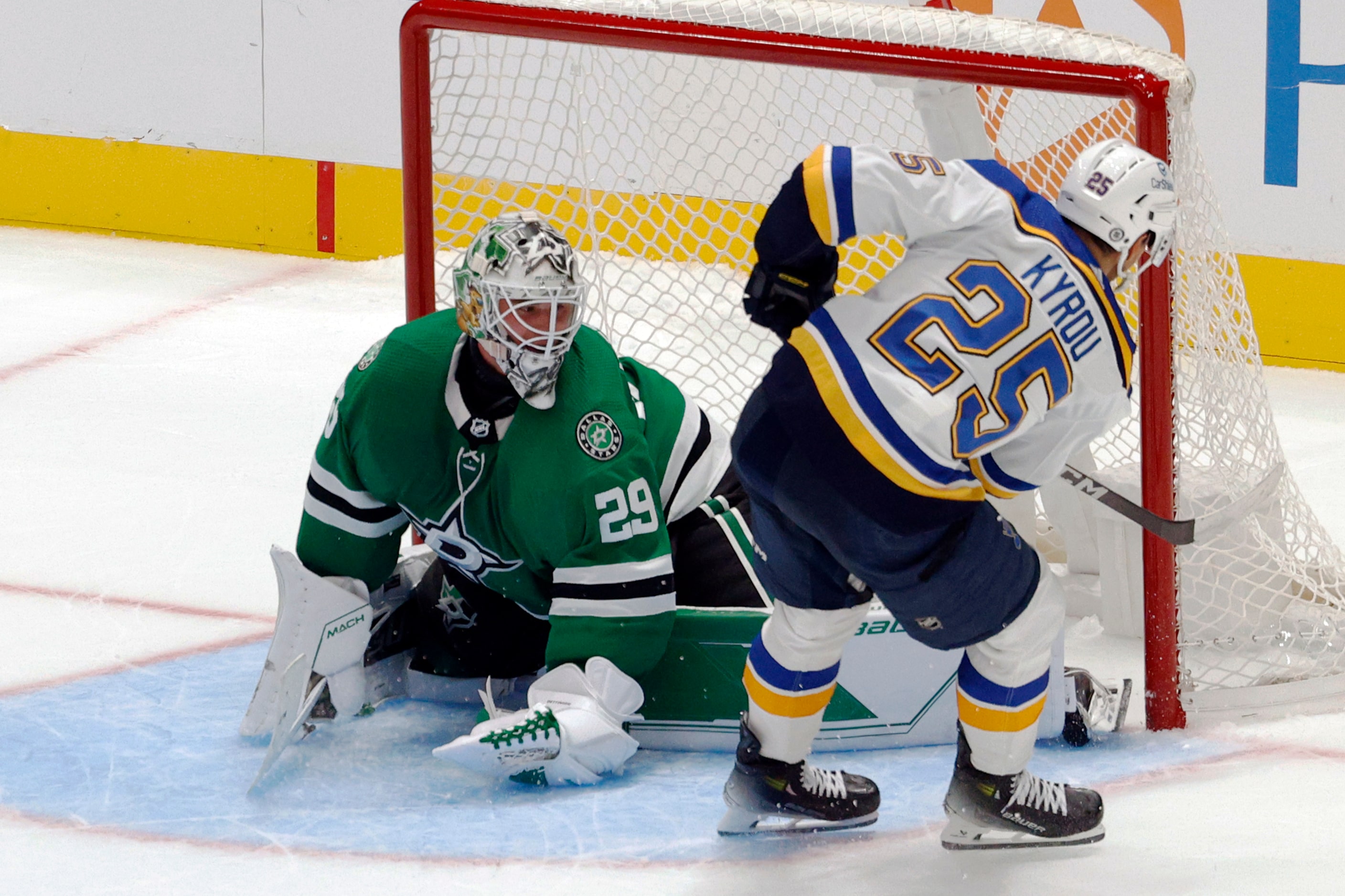 Dallas Stars goaltender Jake Oettinger (29) stops a shot from St. Louis Blues center Jordan...