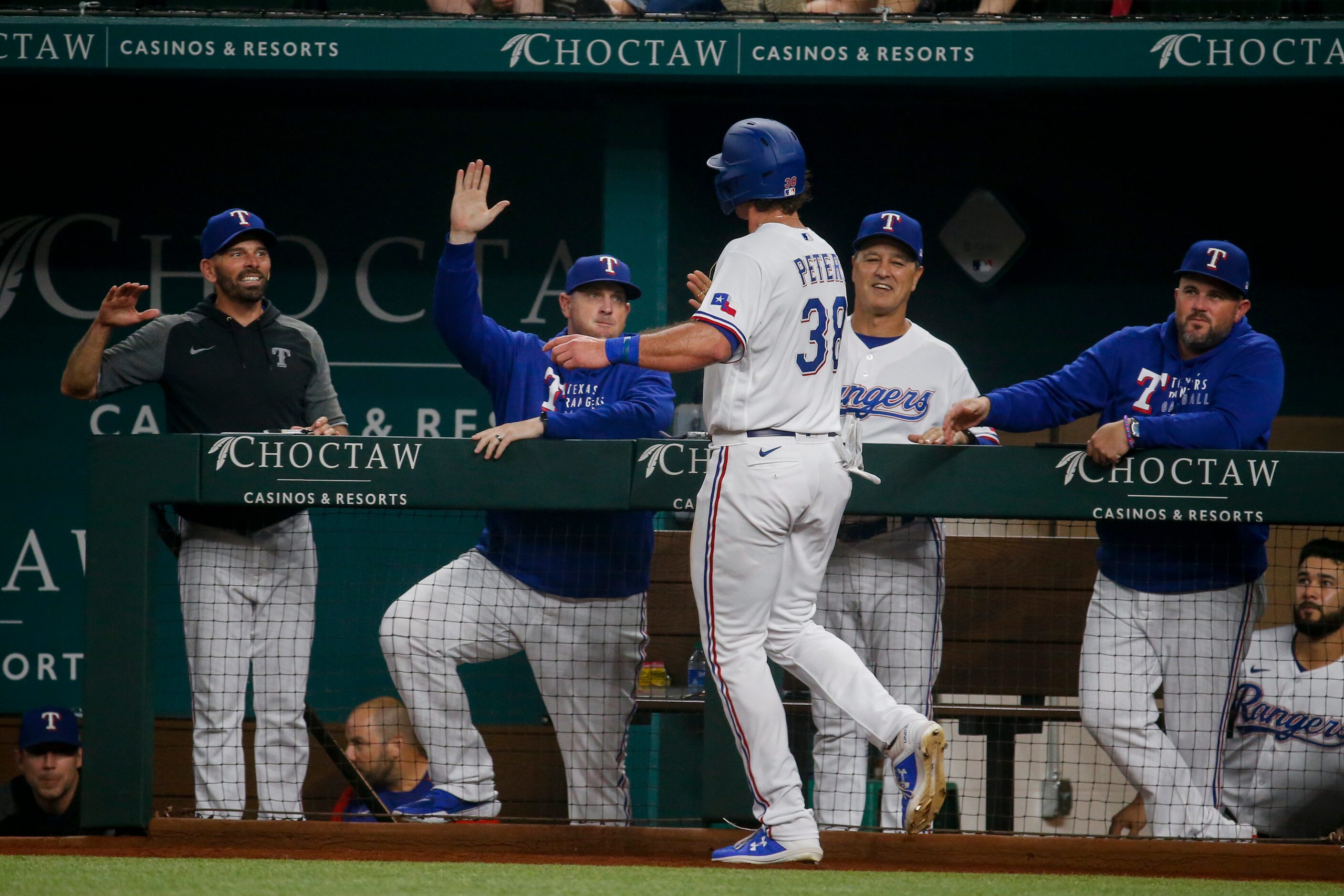 Texas Rangers center fielder DJ Peters (38) celebrates after running to home following Texas...