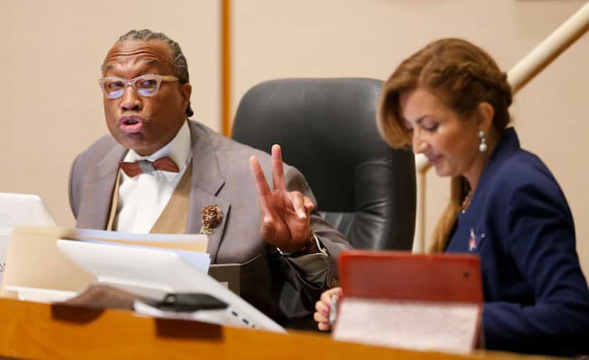 Dallas County Commissioner John Wiley Price speaks next to District 4 Commissioner Elba...