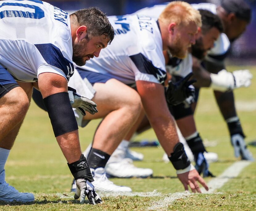 Dallas Cowboys guard Zack Martin (left) lines up beside center Tyler Biadasz, guard Connor...