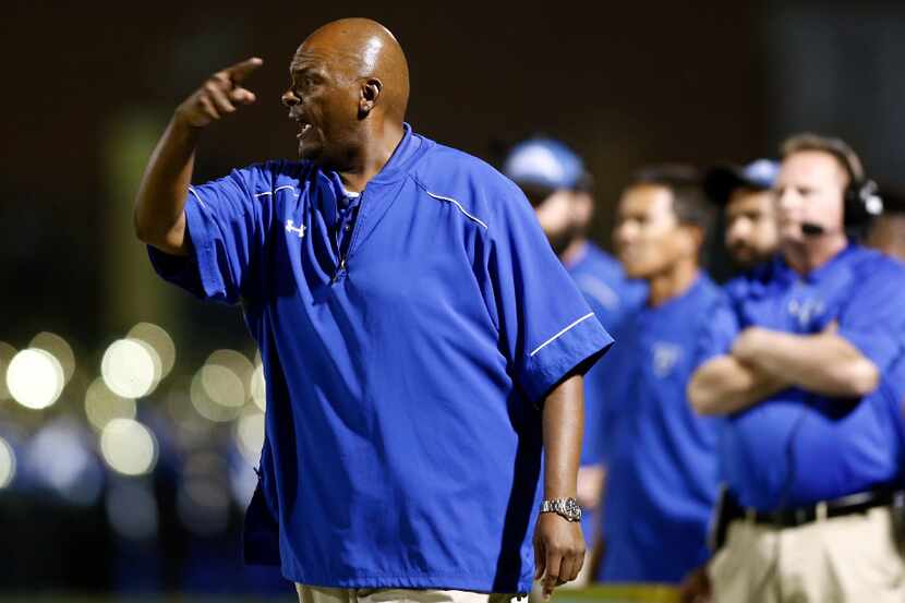 North Mesquite football coach Mike Robinson gestures toward the field during a game in 2016....