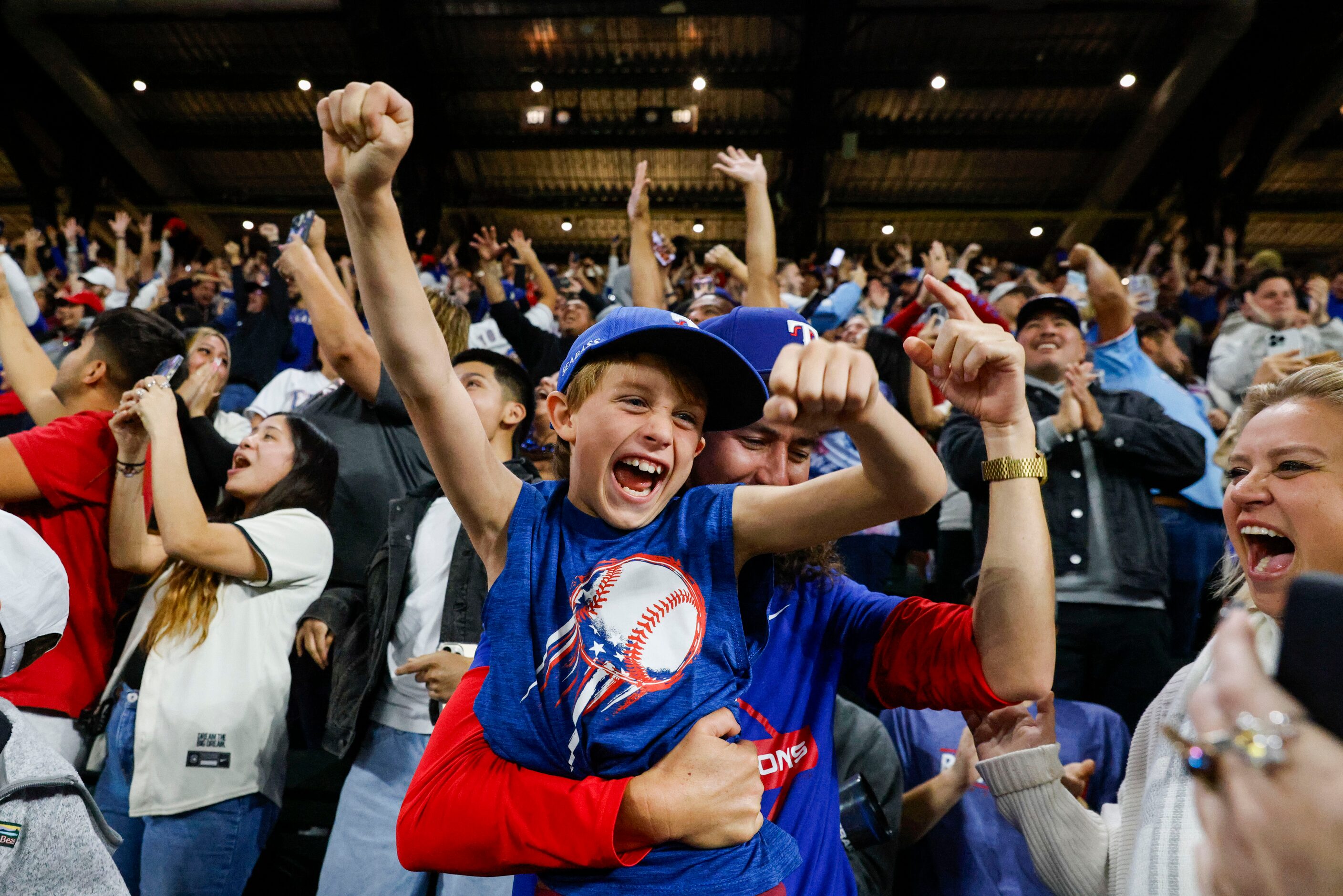 Fans cheer following Texas Rangers’ winning the World Series in five games against the...