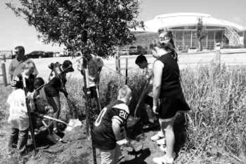  Youths from the Arlington Thunder Football Association dug in and got their hands dirty...