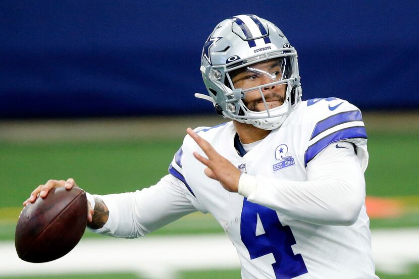 Dallas Cowboys quarterback Dak Prescott (4) throws a fourth quarter pass against the...