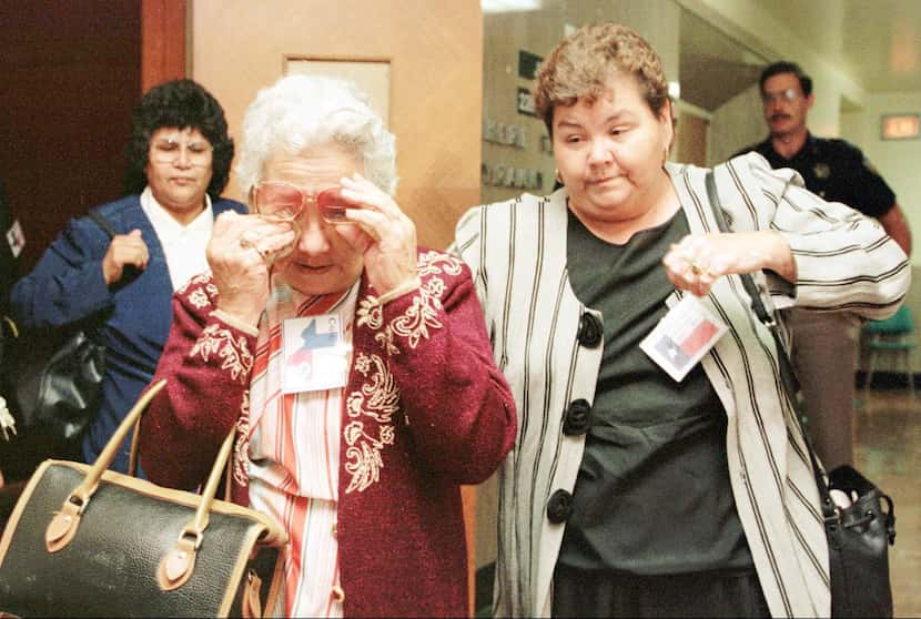 Juanita Saldivar, left, mother of convicted killer Yolanda Saldivar, leaves the courtroom...