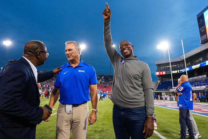 SMU legendary “Pony Express” running backs Eric Dickerson (right) and Craig James on the...