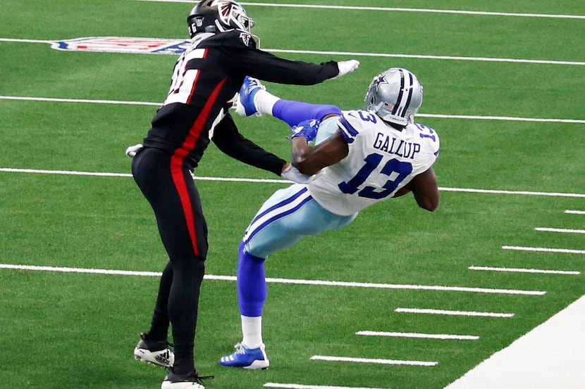 Dallas Cowboys wide receiver Michael Gallup (13) makes a catch in front of Atlanta Falcons...