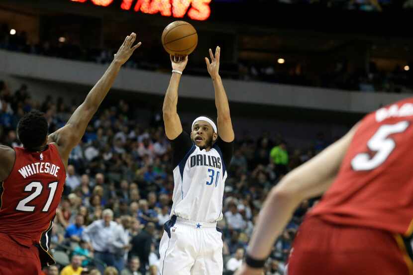 Dallas Mavericks guard Seth Curry (30) shoots against Miami Heat center Hassan Whiteside...