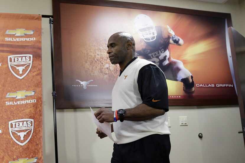 Texas coach Charlie Strong arrives to talk about his recruiting class during an NCAA college...