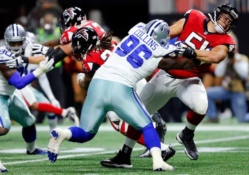 Dallas Cowboys defensive tackle Maliek Collins (96) wrestles with Atlanta Falcons linebacker...