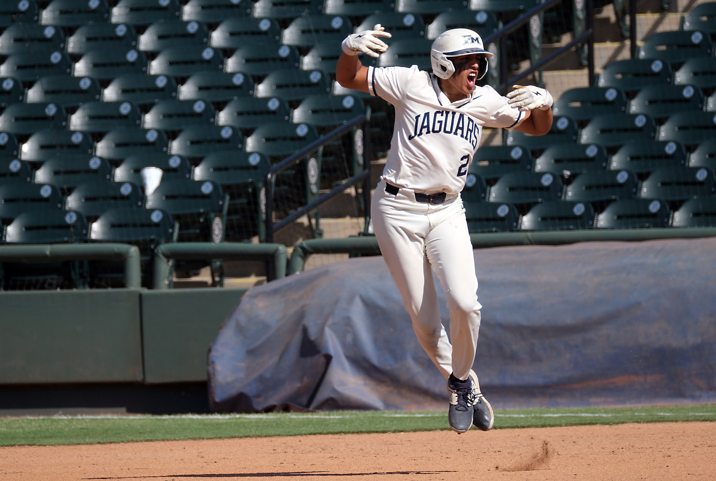 Flower Mound Adrian Rodriguez, (2), celebrates after hitting a two-run home run against...