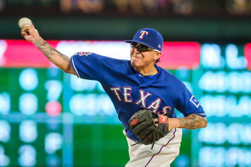 Texas Rangers relief pitcher Jesse Chavez pitches during the eighth inning against the...