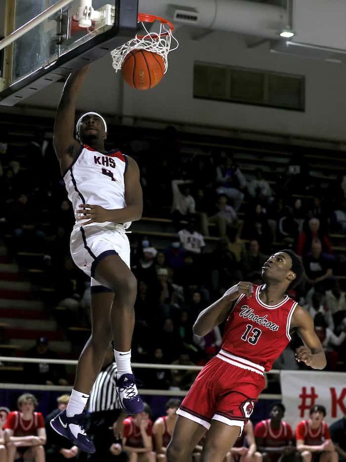 Kimball forward DaCannon Wickware (4) goes in for a dunk against Woodrow Wilson forward...
