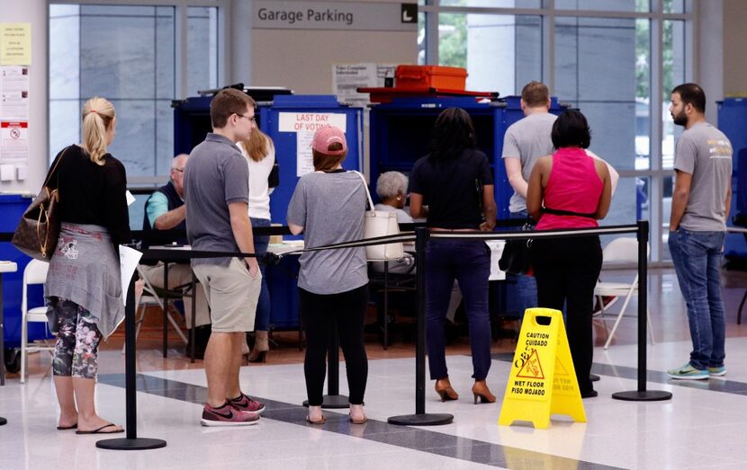 People lined up to vote early at the George L. Allen Sr. Courts Building in downtown Dallas...