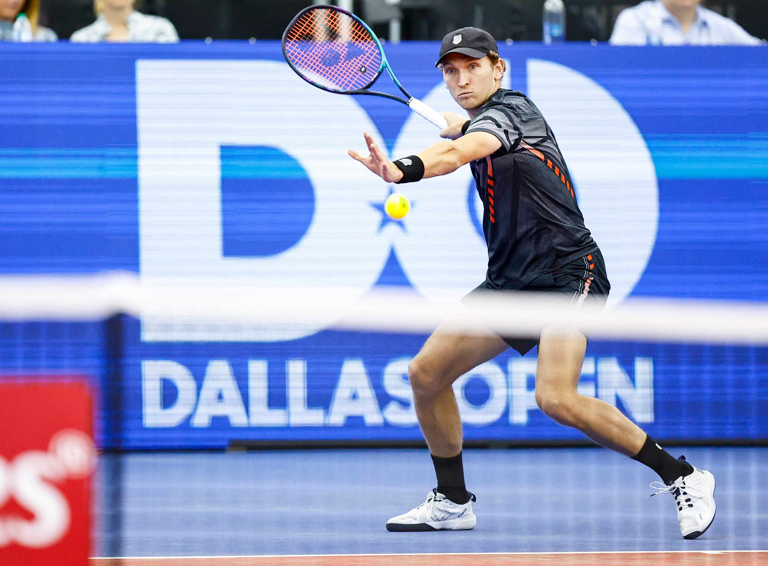 Mitchell Krueger, a Fort Worth native, returns the ball in a match against Yoshihito...