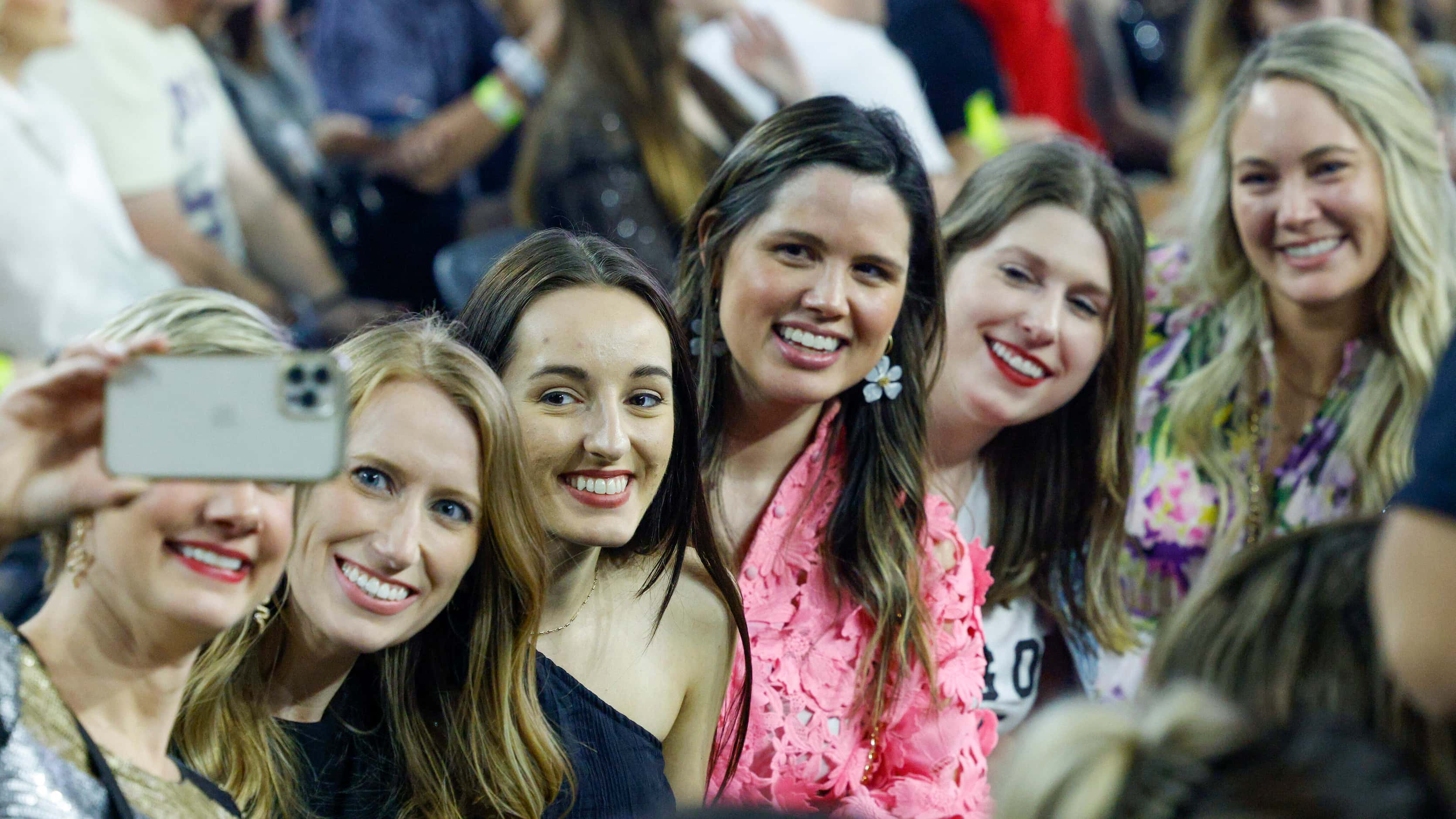 Fans pose for a selfie before Taylor Swift’s Eras Tour concert at AT&T Stadium on Friday,...