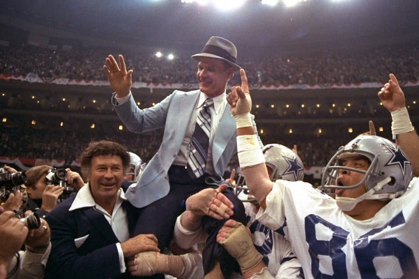 FILE - In this Jan. 15, 1978, file photo, Dallas Cowboys head coach Tom Landry is given a...