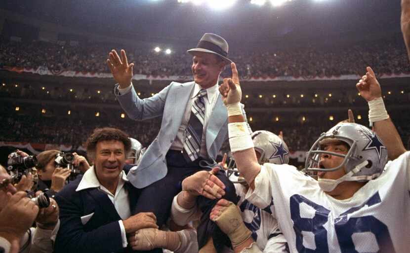 FILE - In this Jan. 15, 1978, file photo, Dallas Cowboys head coach Tom Landry is given a...