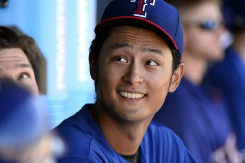 Texas Rangers pitcher Yu Darvish (11) in the dugout after his start against the Cincinnati...
