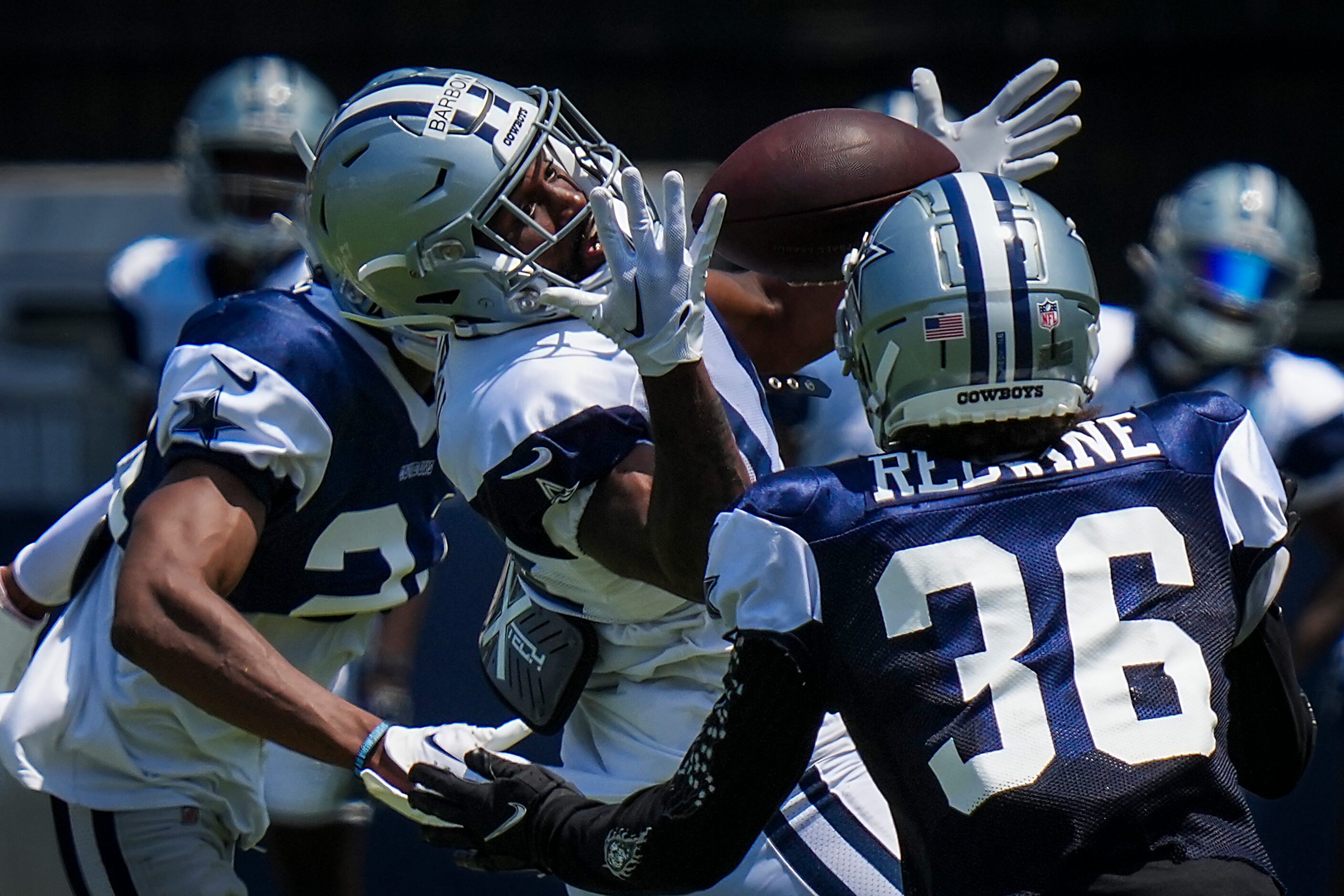 Dallas Cowboys wide receiver Jose Barbon (14) can’t make a catch as defensive back Sheldrick...