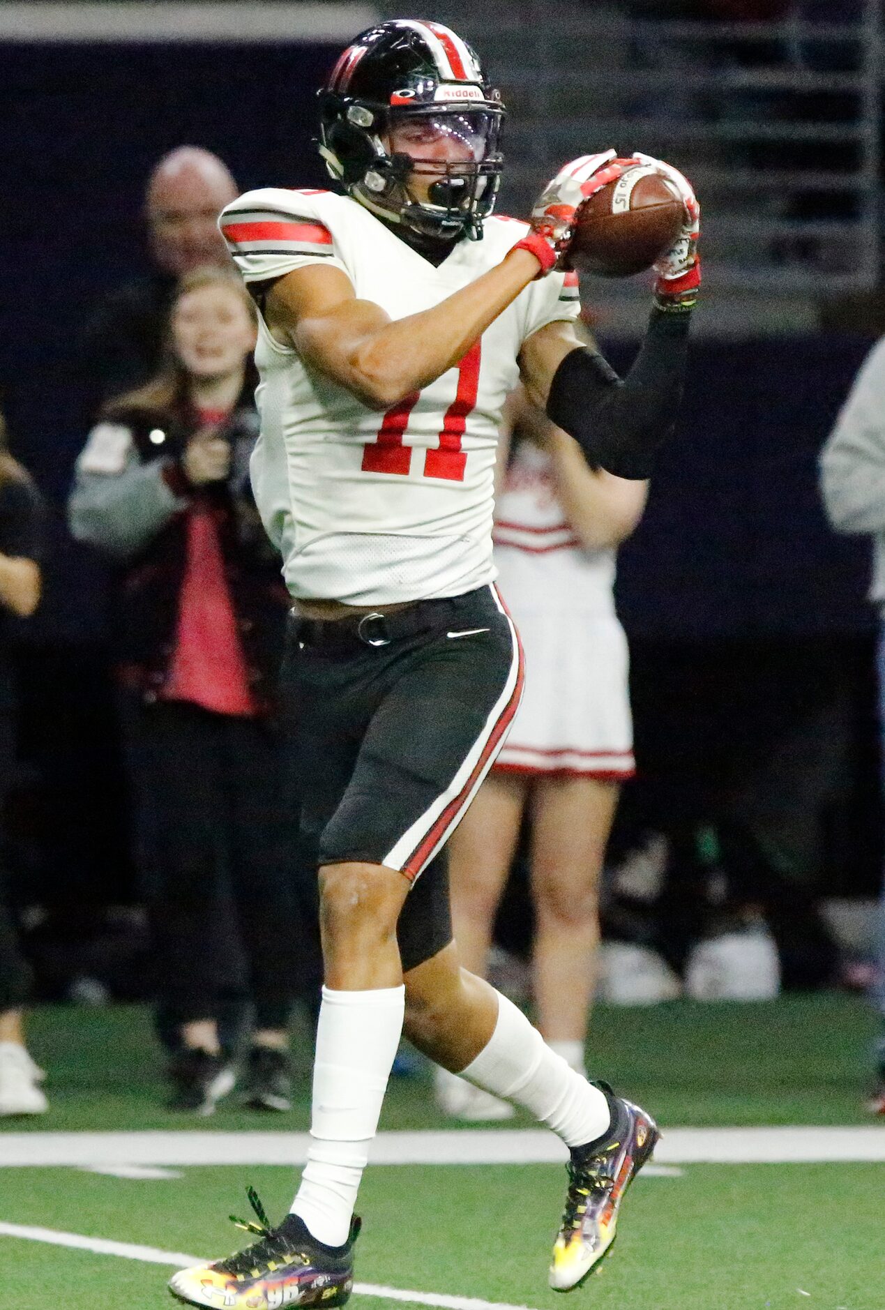 Lovejoy High School wide receiver Omari Murdock (11) runs all alone as he reaches back to...