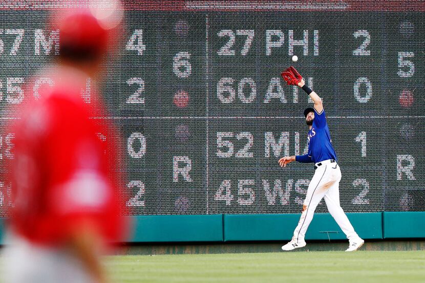 Texas Rangers left fielder Joey Gallo (13) catches a fly ball from Los Angeles Angels...