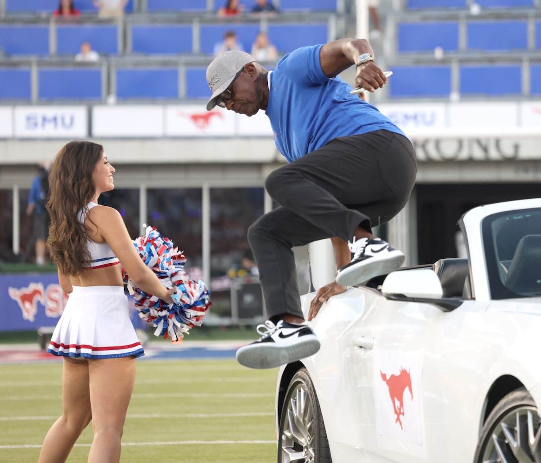 Southern Methodist University alum and NFL Hall of Fame running back Eric Dickerson shows he...