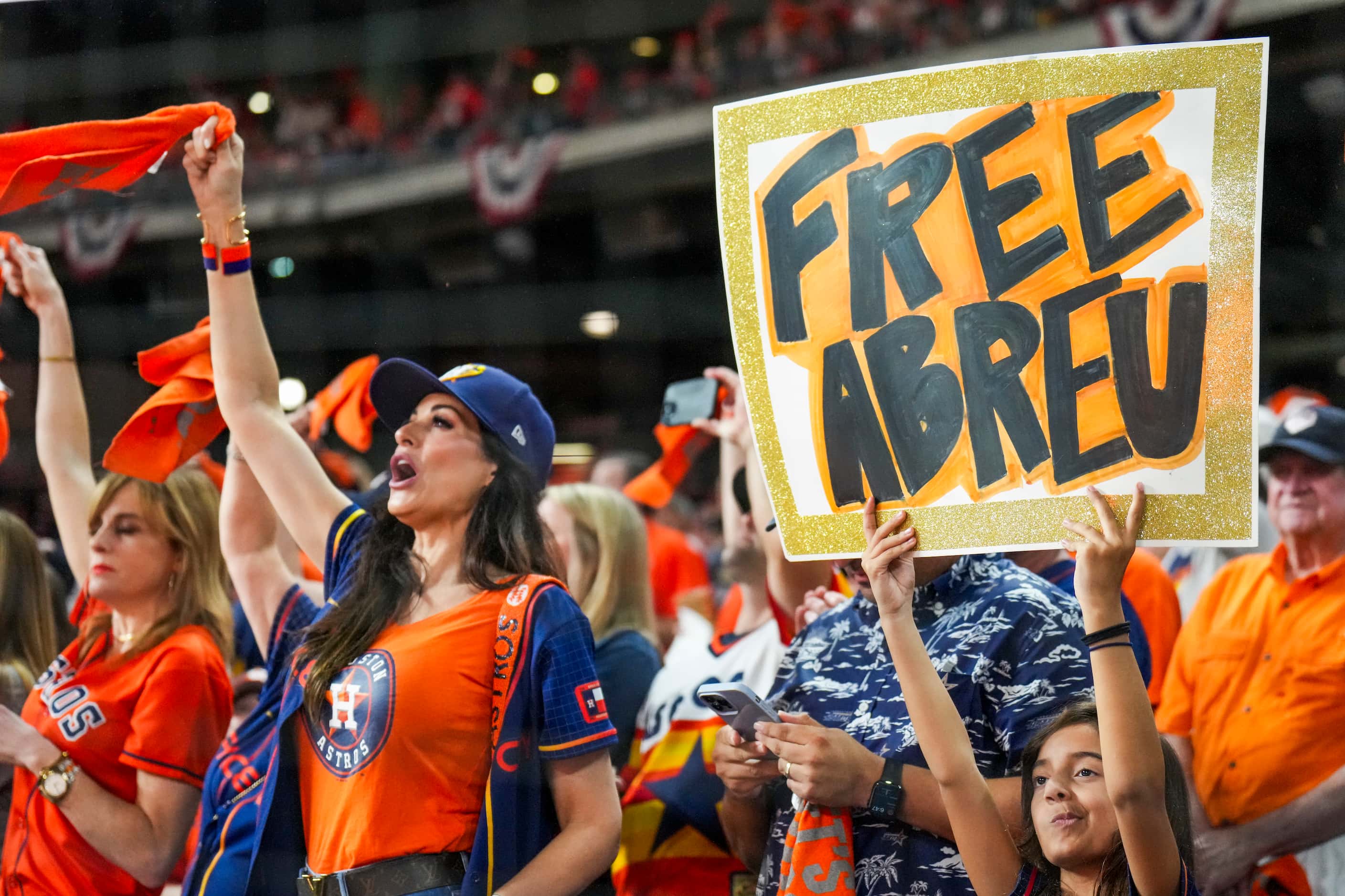 Fan holds up a sign referencing the Houston Astros relief pitcher Bryan Abreu before Game 6...
