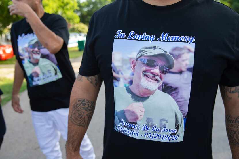 Family members of the late Lazarus De La Torre wear T-shirts bearing one of their favorite...