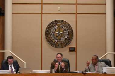 Dallas County Judge Clay Jenkins (middle) spoke alongside Dallas County Commissioners J.J....
