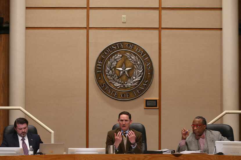 Dallas County Judge Clay Jenkins (middle) spoke alongside Dallas County Commissioners J.J....