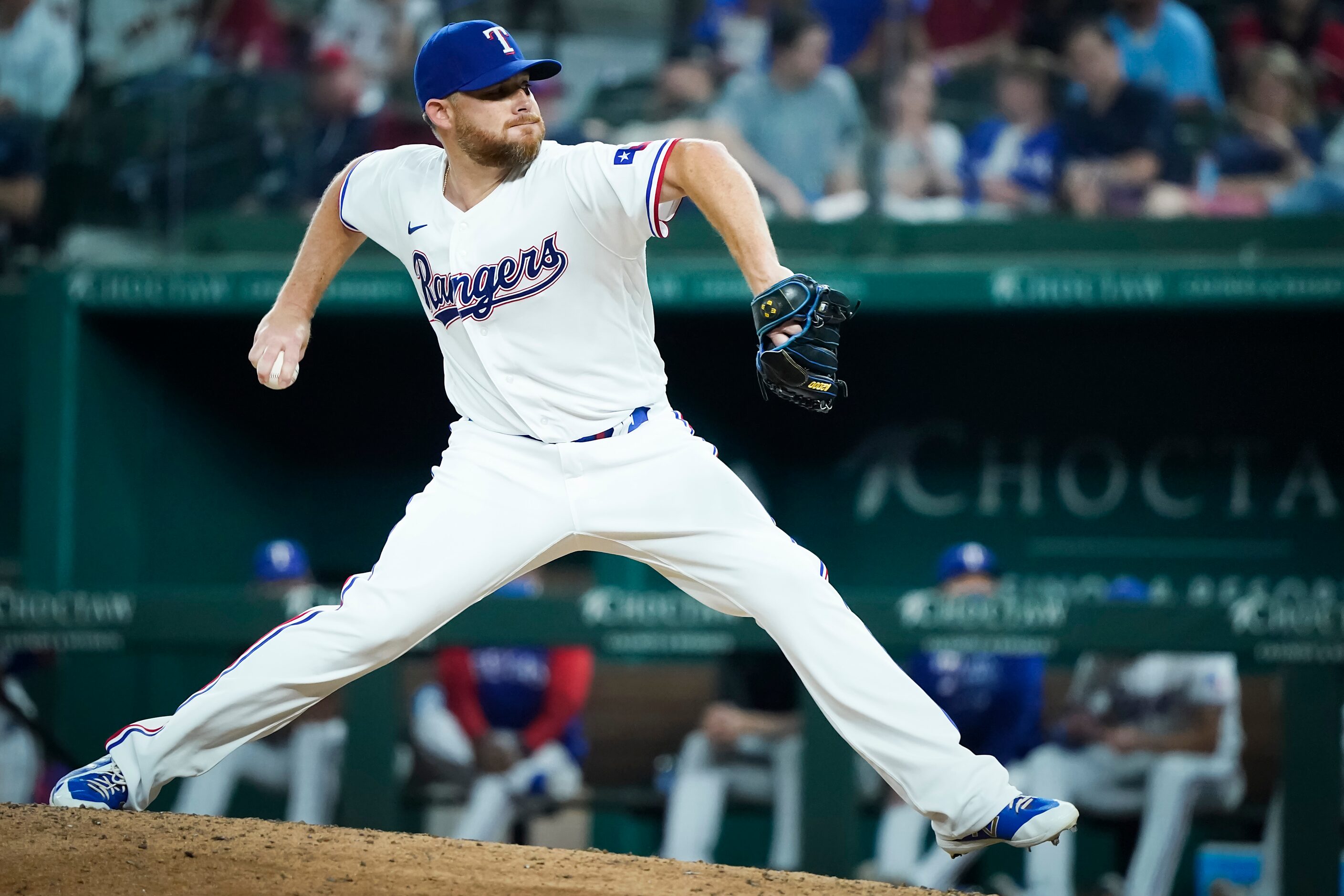 Texas Rangers relief pitcher Ian Kennedy delivers during the ninth inning against the Boston...