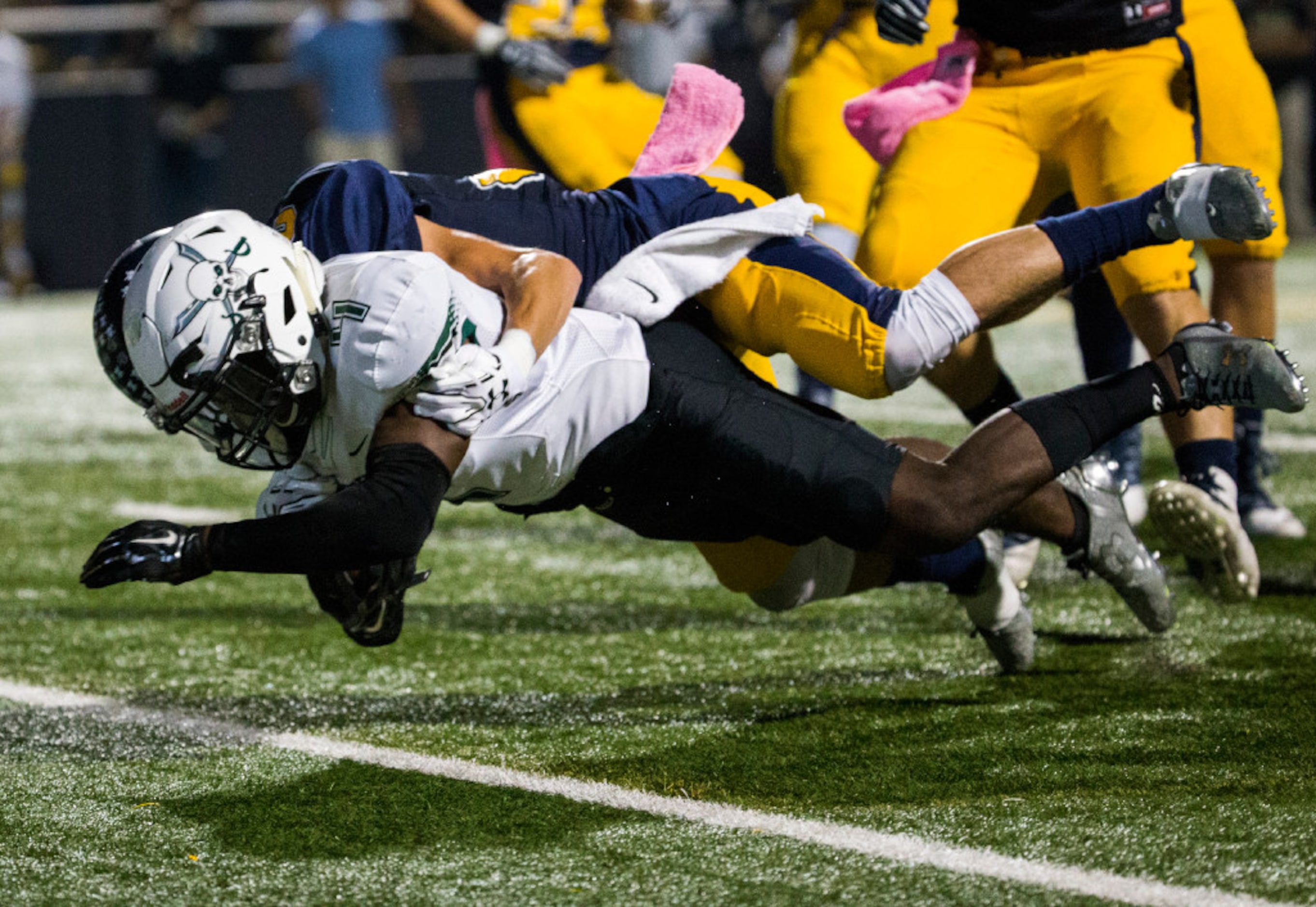 Mesquite Poteet running back Daiquon Jackson (4) dives over the goal line for a touchdown...