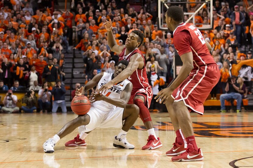 Jan 13, 2016; Stillwater, OK, USA; Oklahoma State Cowboys guard Jawun Evans (1) fouled by...