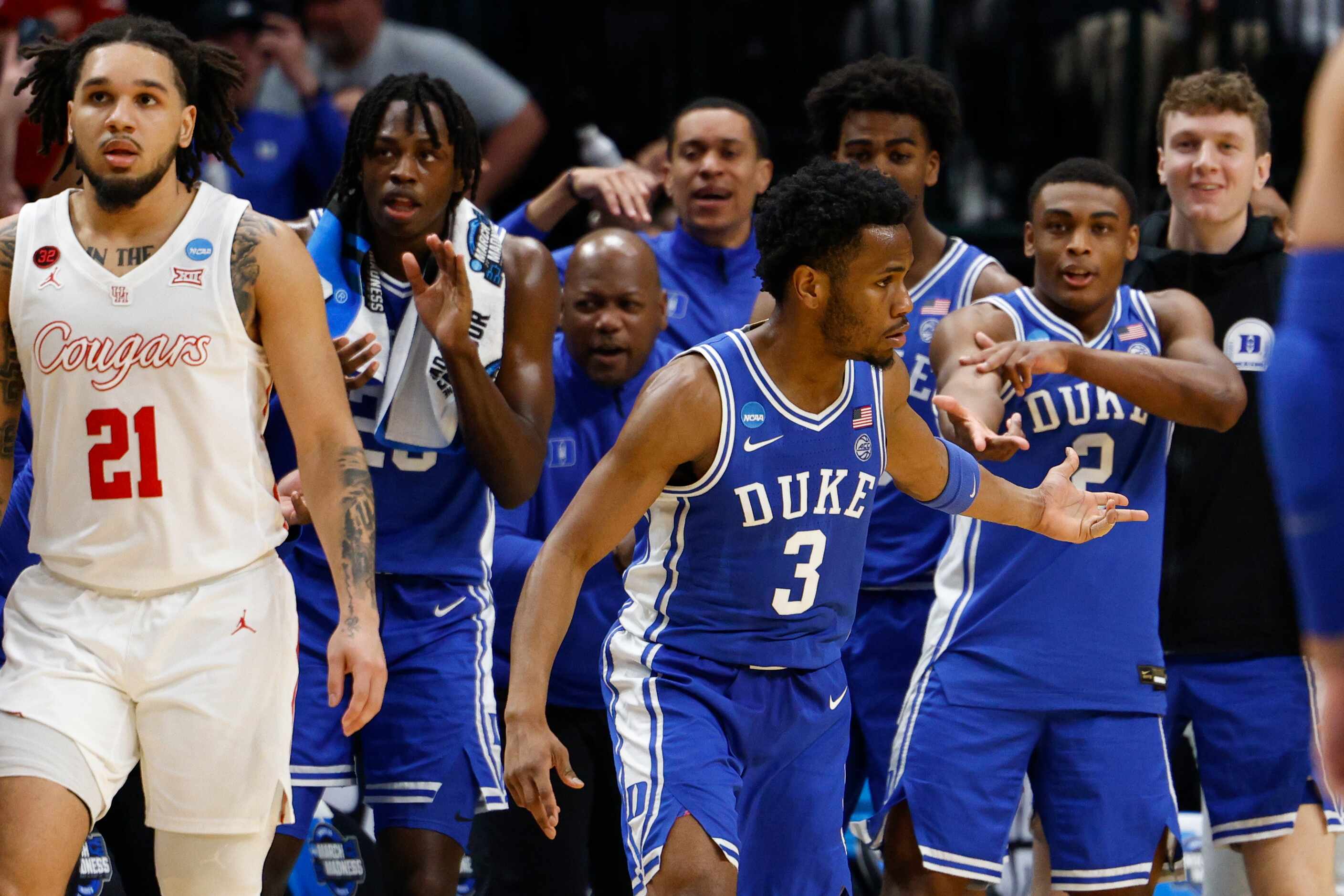 Duke guard Jeremy Roach (3) celebrates with teammates after making a three-pointer alongside...