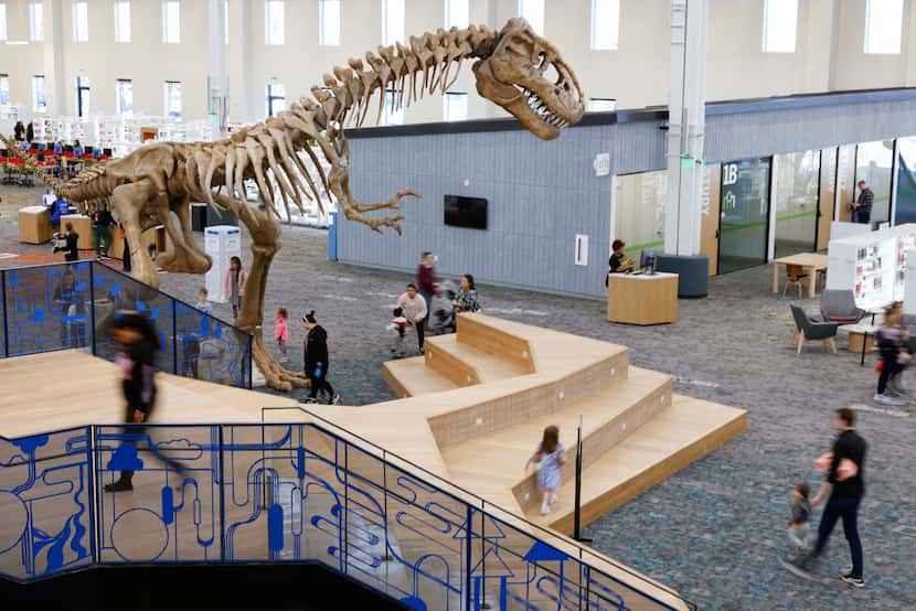 Rexy, a 21-foot T-rex replica on the floor of the new Frisco Public Library.