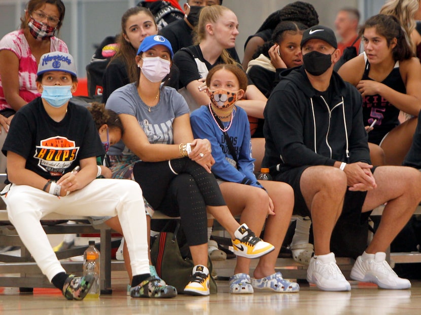 Dallas Mavericks head coach Jason Kidd, right,  watches alongside his family in attendance...