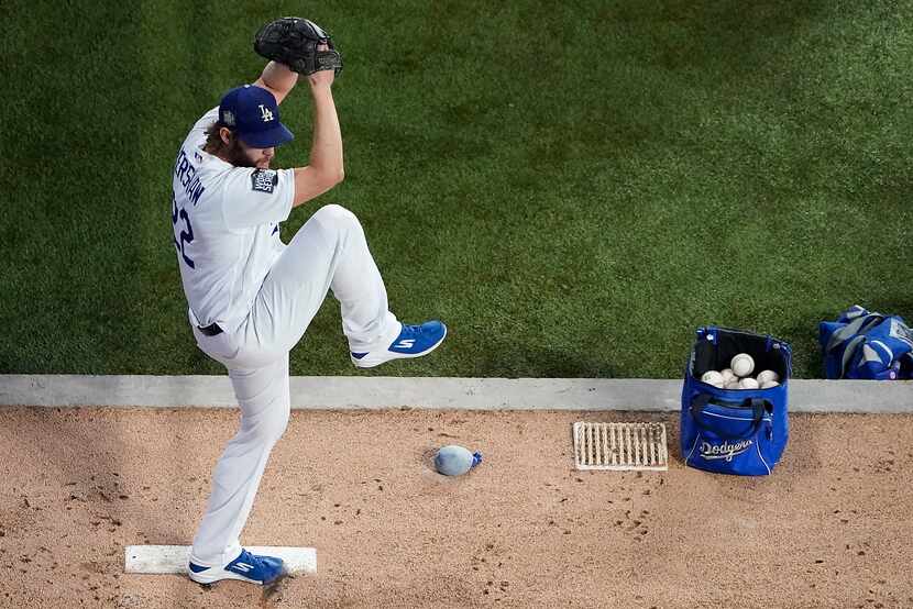 Los Angeles Dodgers starting pitcher Clayton Kershaw warms up in the bullpen before Game 1...